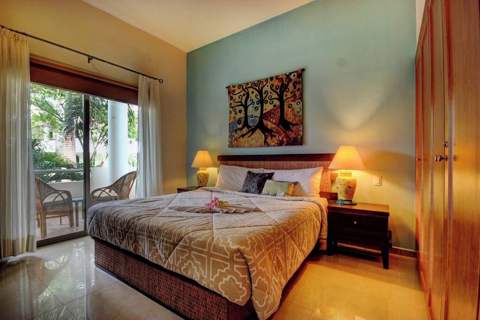 Master bedroom with king-size bed and full bathroom