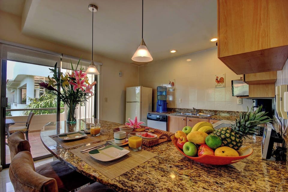 Kitchen with dishwasher, refrigerator and quality utensils