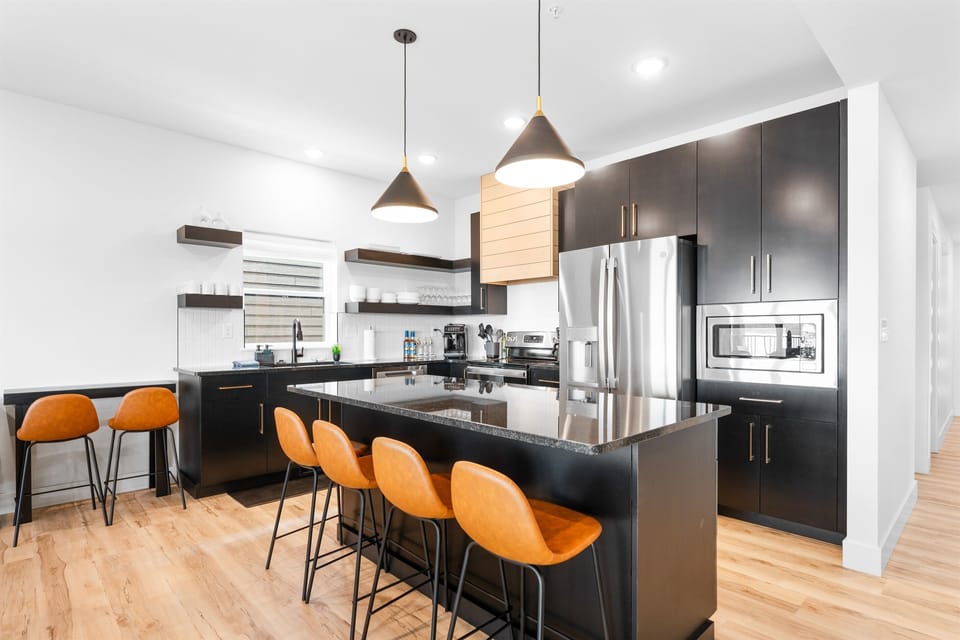 Whip up your favorites with ease in this modern, fully stocked kitchen—complete with all the essentials for home-cooked meals, quick snacks, and late-night cravings.