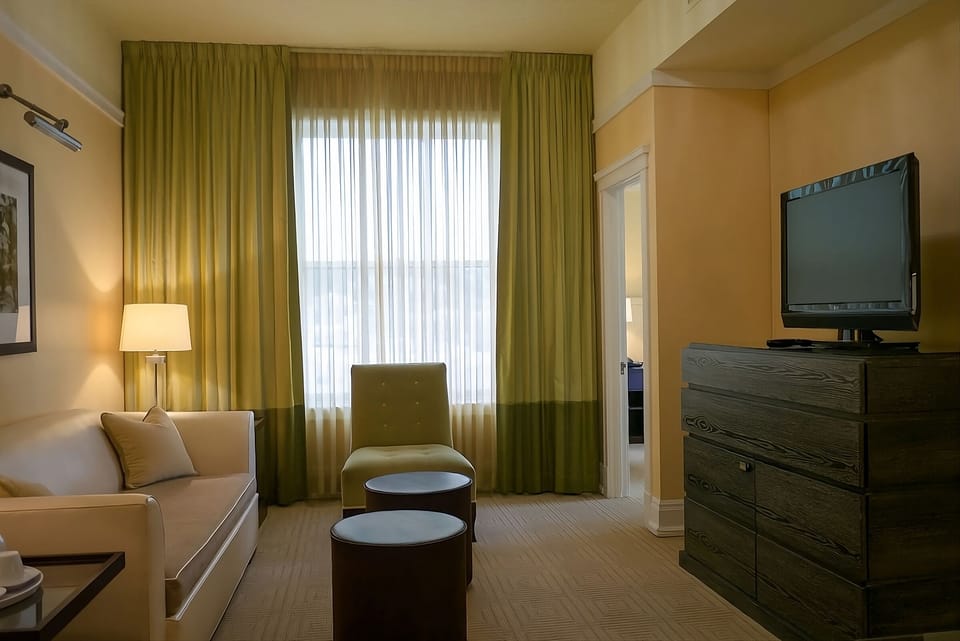 Relax in a cozy lounge area with warm, natural light.