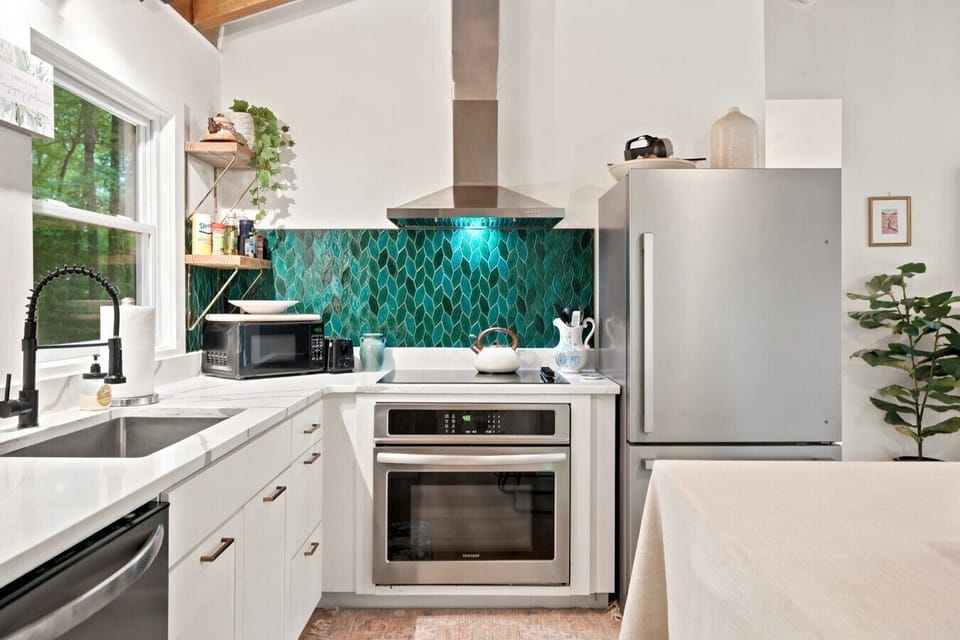 Kitchen | Teal Leaf Tile Backsplash | Stainless Appliances & Open Shelving