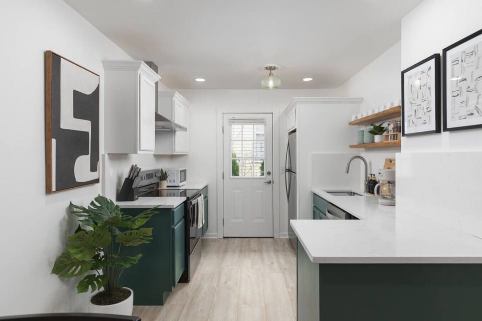 Fully equipped kitchen with all your cooking essentials, drip coffee maker + coffee. This room opens up into the dining area with seating for 5, and into the living room.