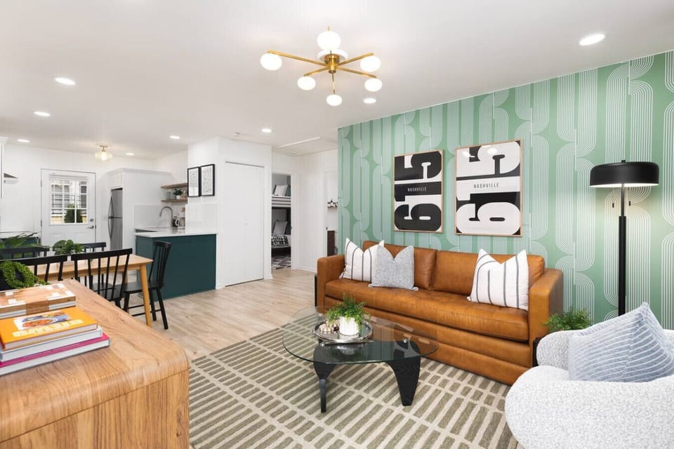 Comfortable, cozy living room with lots of natural light! Smart TV with all the apps you could want + comfortable seating, including a queen sized sofa bed.