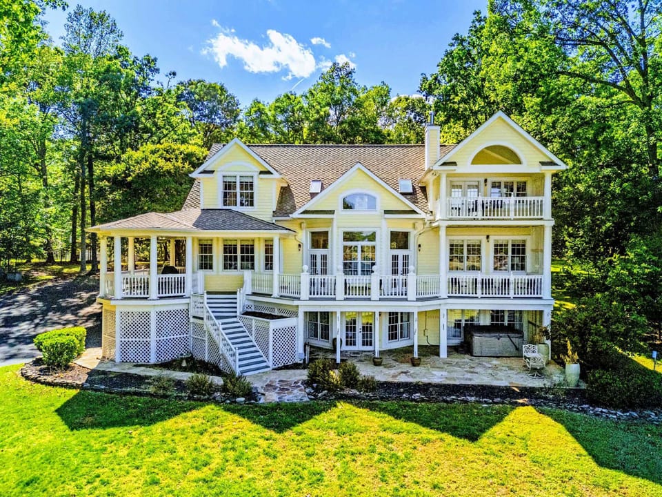 From Above - Multi-tiered decks and balconies wrap the back of the home.