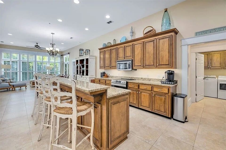 Granite counters, stainless steel appliances, and bar seating for entertaining