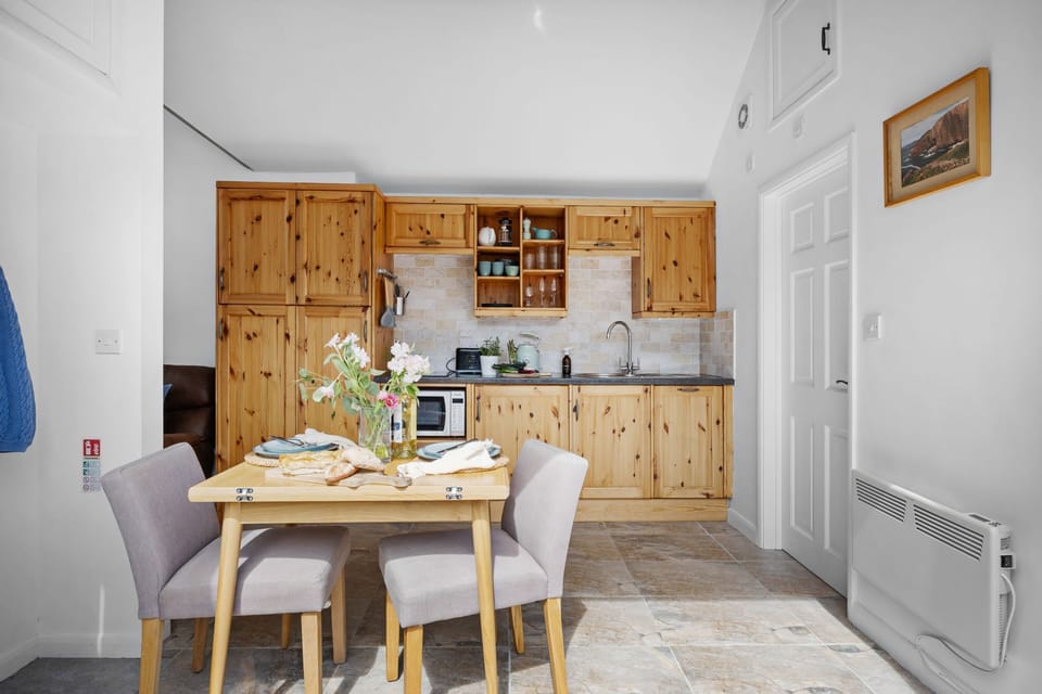 Kitchen and dining space, combination microwave, hob, fridge with ice box - The Granary