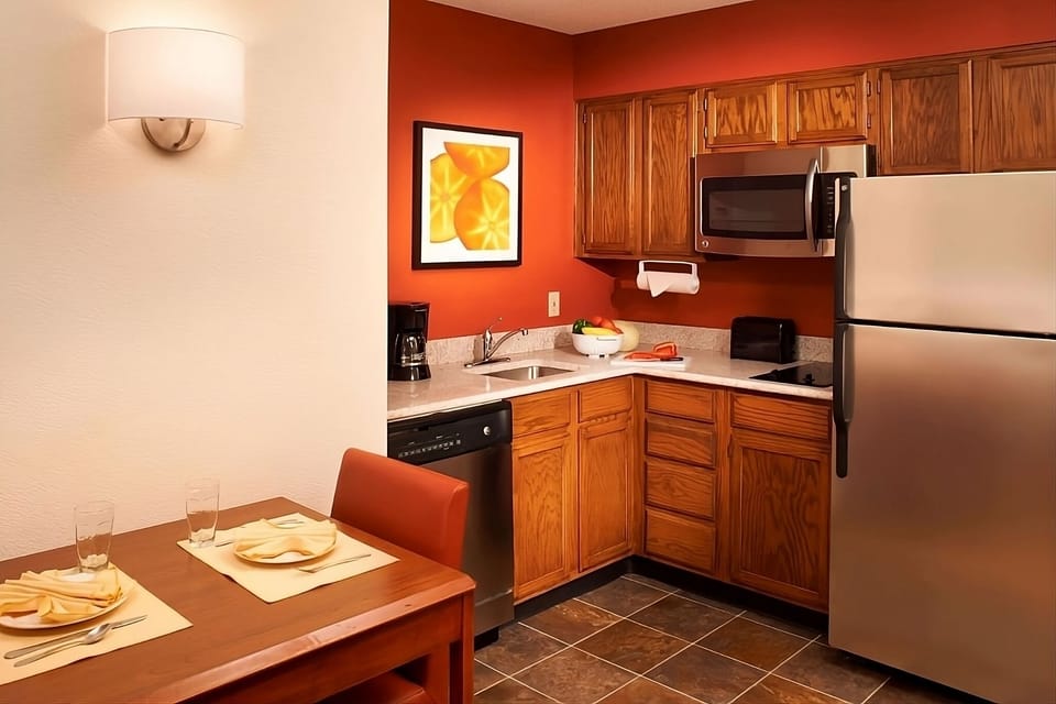 Cook with ease in a tidy kitchenette with modern essentials.