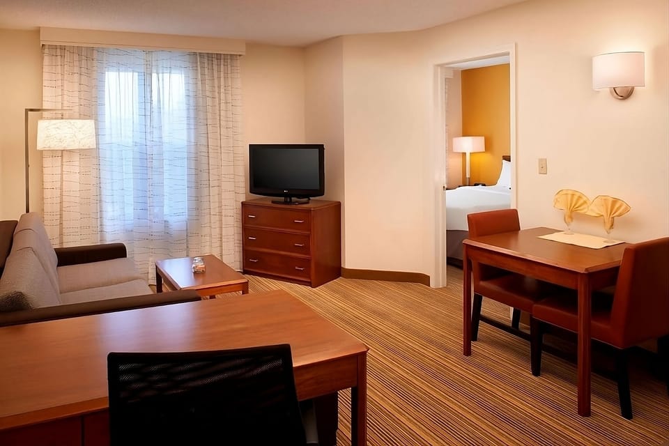 Settle in with a cozy sofa and easy in-room dining.