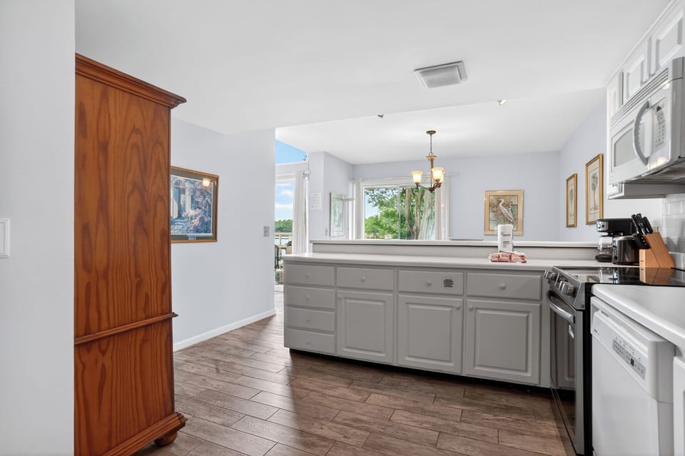 Clean, fully equipped kitchen with stainless steel appliances and plenty of counter space for easy meals.