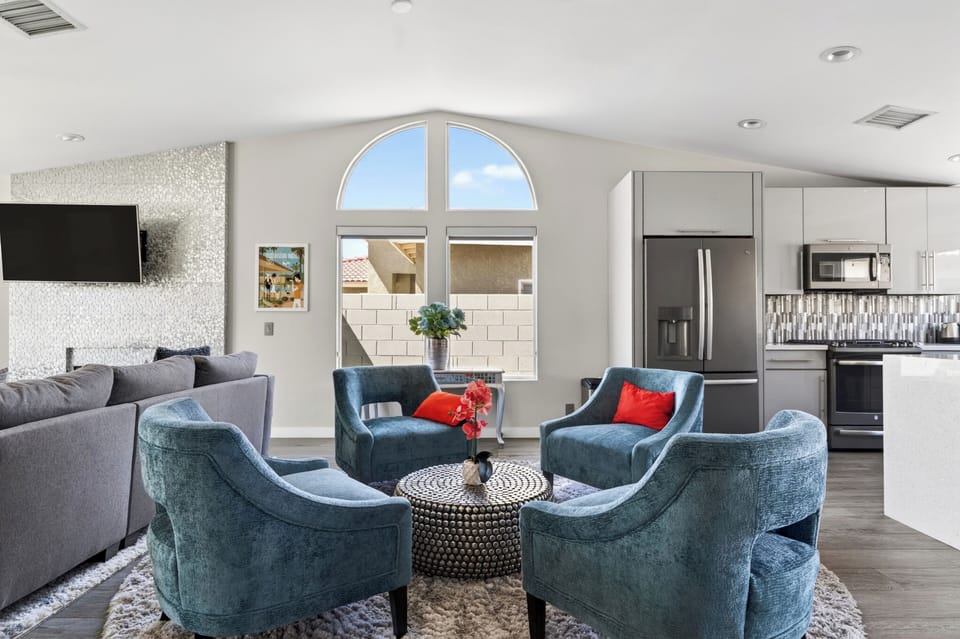 Alternate view of the modern teal seating alcove, perfect for hosting guests or enjoying a quiet morning.
