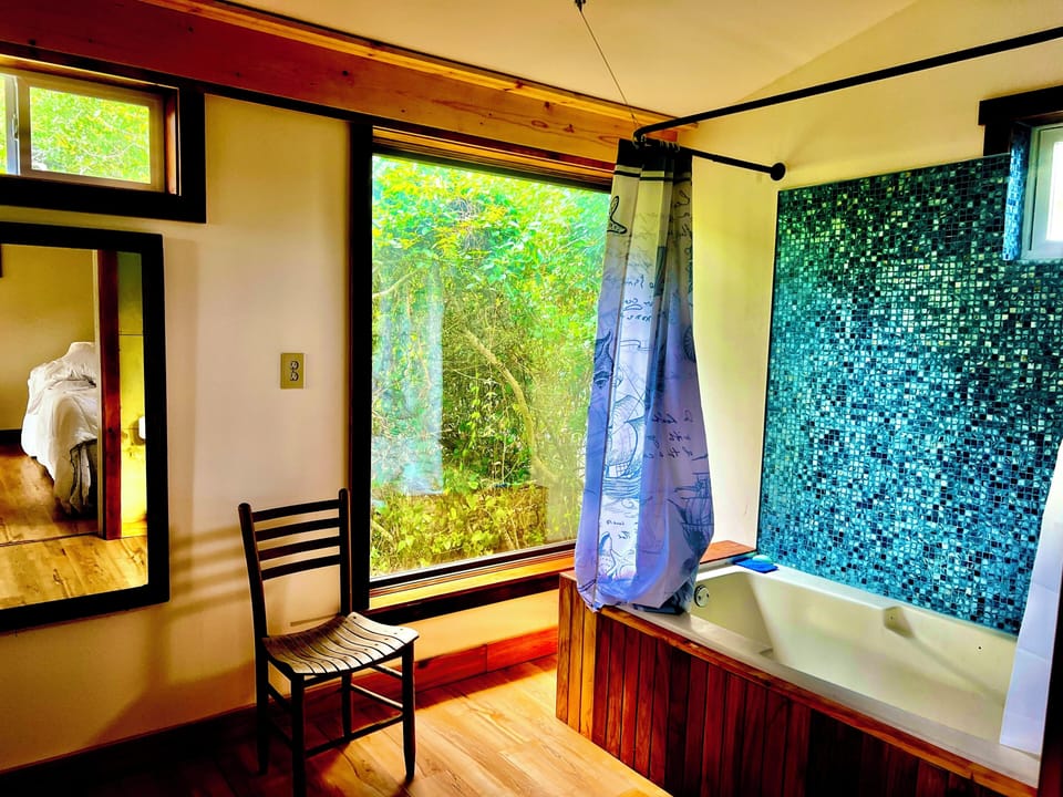 Big picture window for immersing in nature while soaking