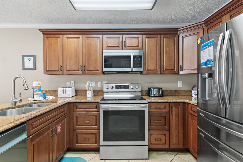 Full kitchen with stainless steel appliances