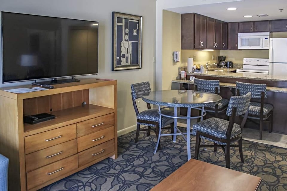 Gather for dinner and games at the cozy dining table.