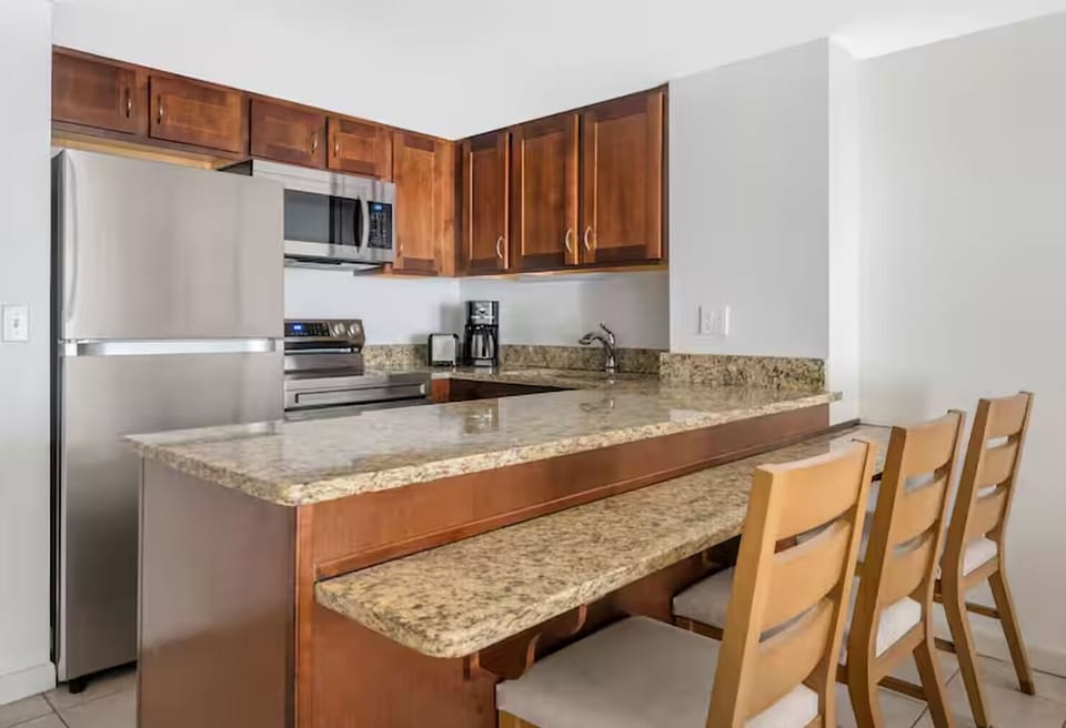 Cook with ease on granite counters and full-size appliances.