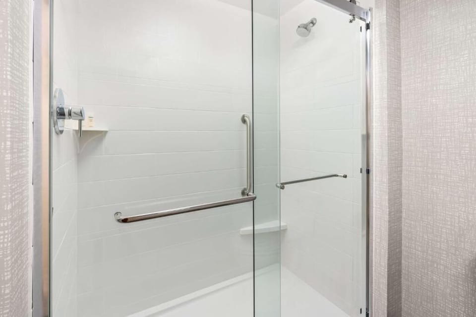 Refresh in a bright walk-in shower with glass doors.