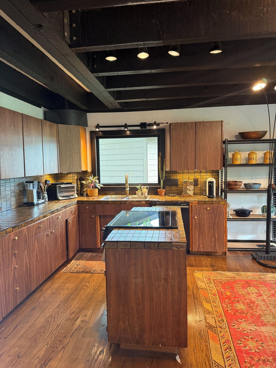 Gourmet kitchen with new designer appliances including convection oven.