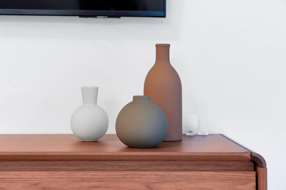 Soft neutral styling with warm designer details