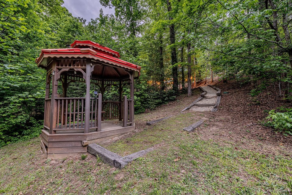 Discover a hidden gem on the property—a charming wooden gazebo and a scenic timber-framed walkway, perfect for a quiet morning coffee or a peaceful moment in nature.