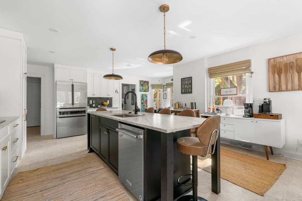 Spacious kitchen with stainless appliances with coffee bar.