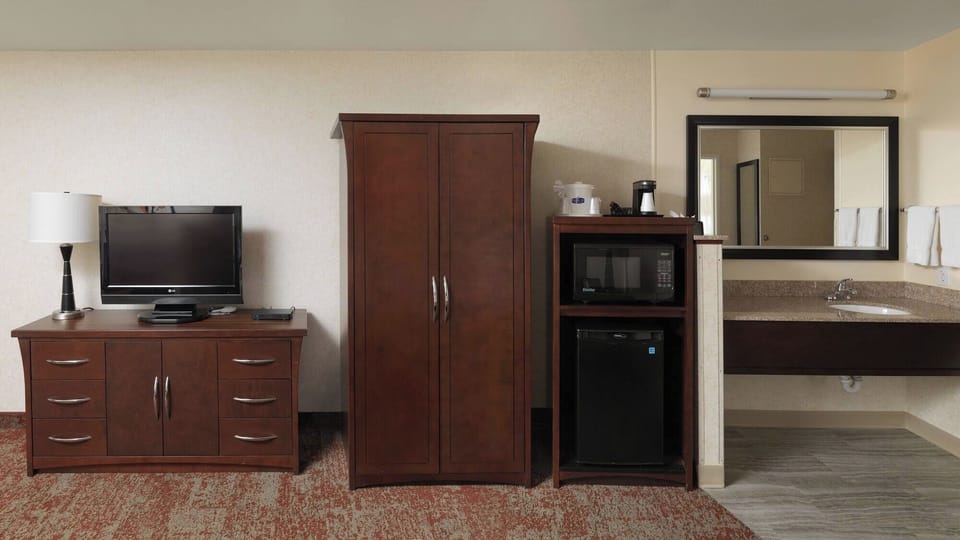 Refresh snacks easily with in-room microwave, fridge, and storage.