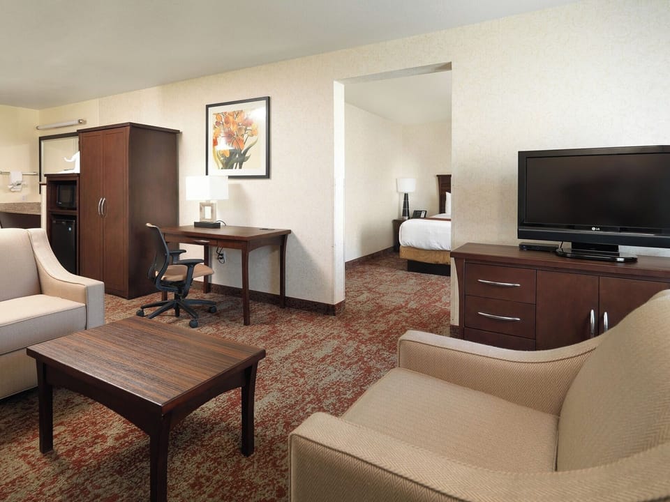 Stretch out in the spacious suite living area and workspace.