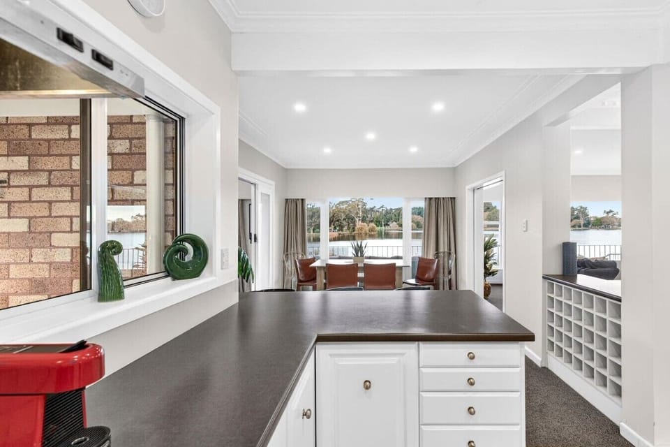Prepare your meals while gazing out at the water—your kitchen opens straight onto lake views and a sprawling deck.