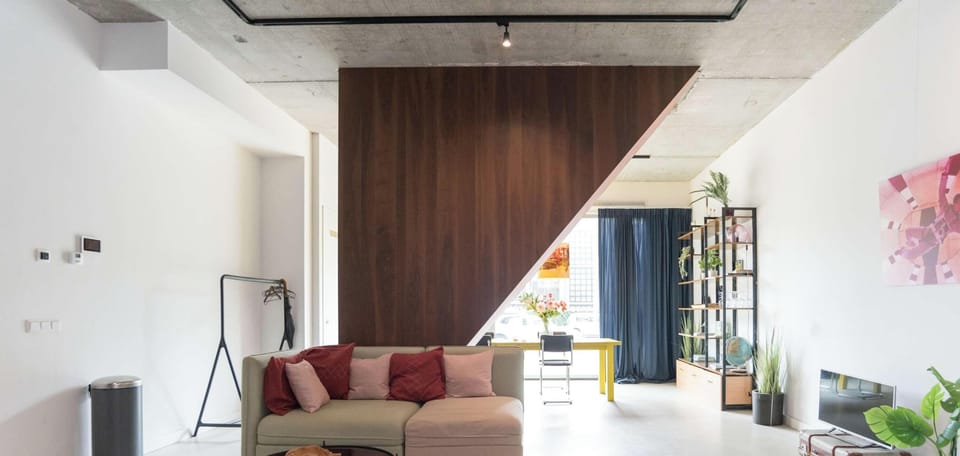 Spacious living area with statement furniture, contemporary art and plenty of natural light.