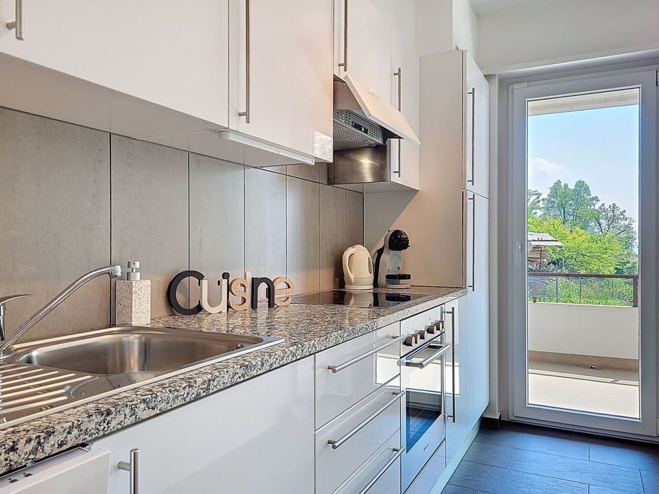 Kitchen, Countertop, Kitchen Appliance, Major Appliance, Cabinetry, Interior Design, Kitchen Sink, Wood, Flooring, Home