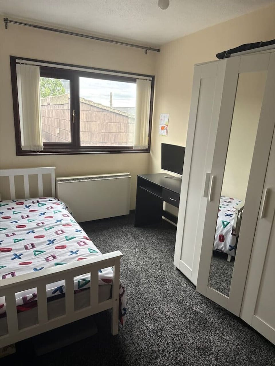 is a bedroom number 2 with desk and closet and single bed 