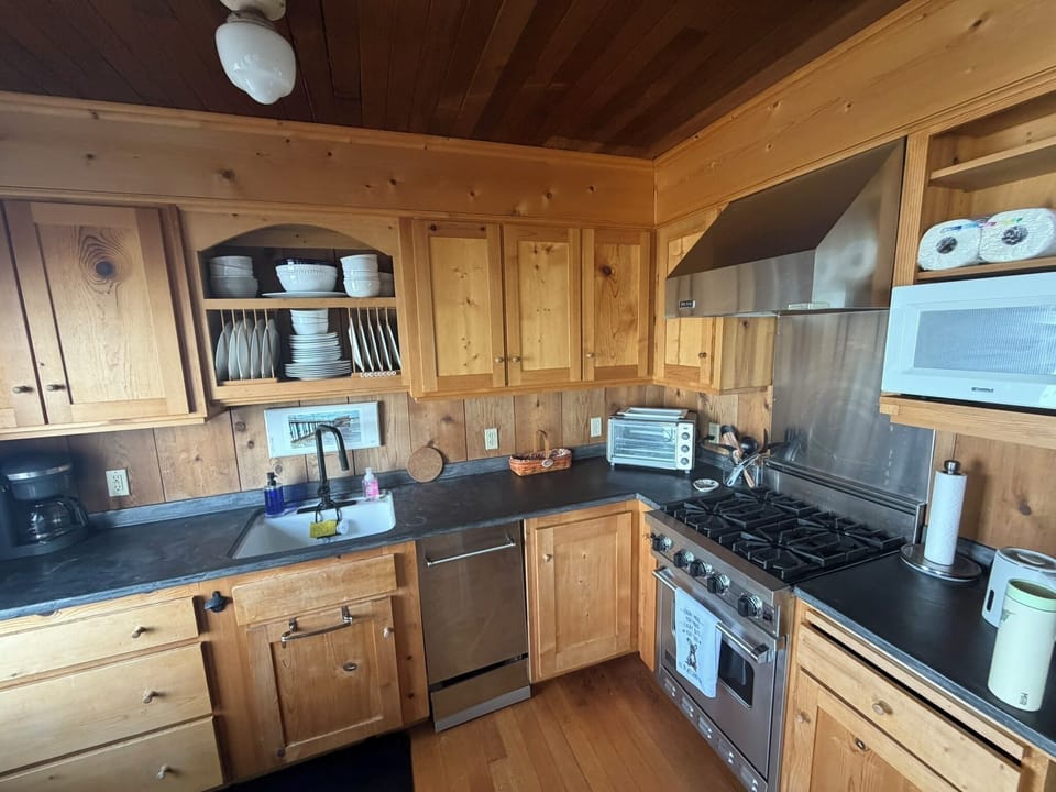 Kitchen - note the custom smaller size dishwasher and stove to fit the character