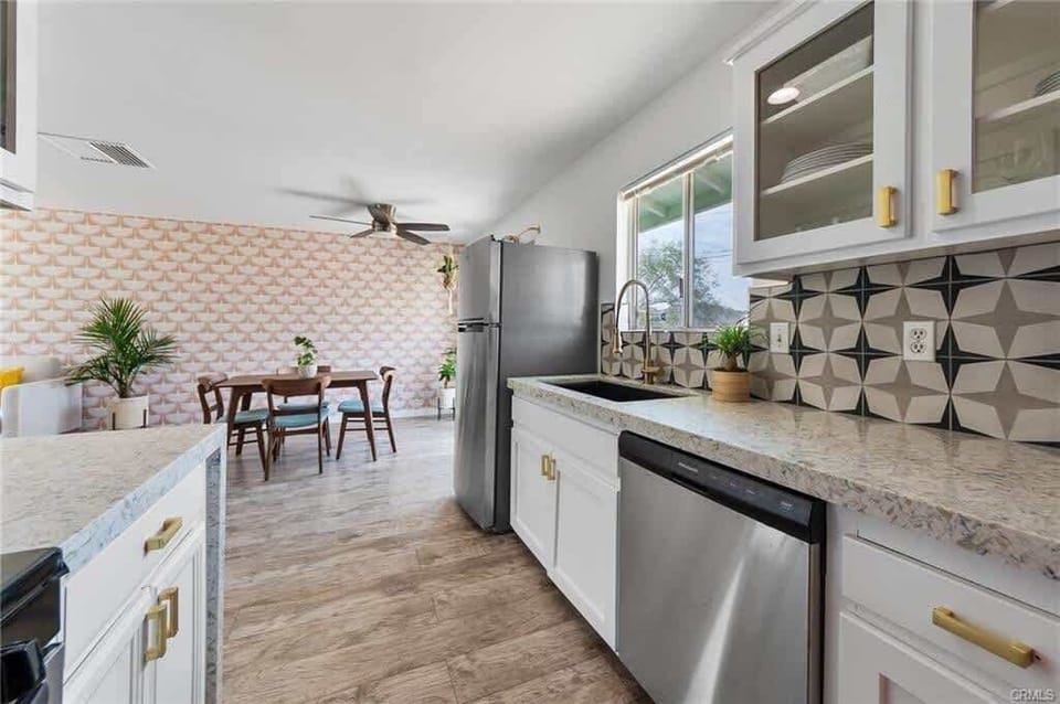 Kitchen includes large farmhouse sink and dishwasher
