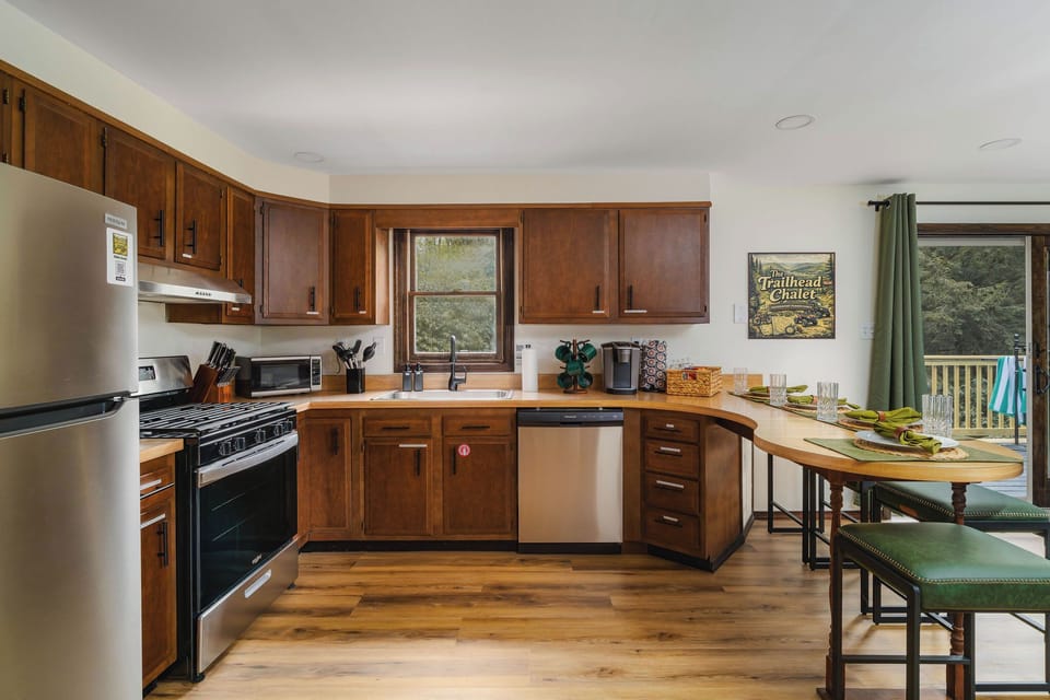 🍳 A fully stocked kitchen with island seating for four — everything you need to cook for a full house.