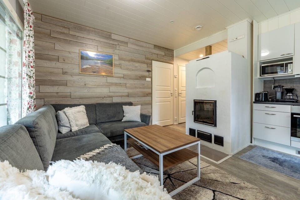 Relax comfortably in a cozy seating area designed for socializing, movie nights, or winding down by the warmth of the fireplace. The open-plan layout ensures you are never isolated from the rest of the group while relaxing.
