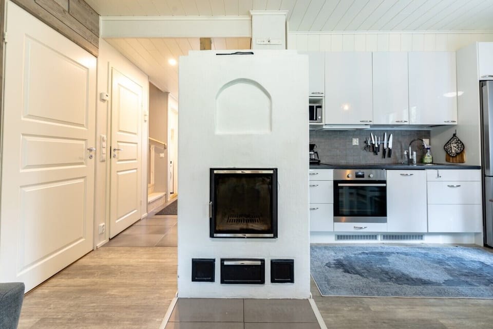 Benefit from an intuitive, open layout that connects the entryway, kitchen, and living spaces for effortless navigation. The central fireplace efficiently warms the entire heart of the home, keeping everyone comfortable.