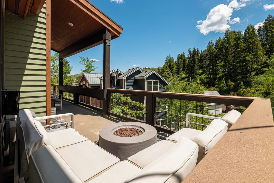 Third-floor Deck access with gas fireplace and seating