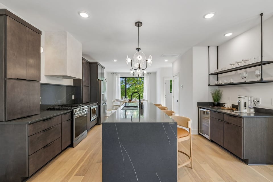 Kitchen: Fully equipped kitchen with modern appliances, sleek countertops, and ample space to cook and dine. Perfect for preparing home-cooked meals, morning coffee, or late-night snacks in a clean, stylish setting.