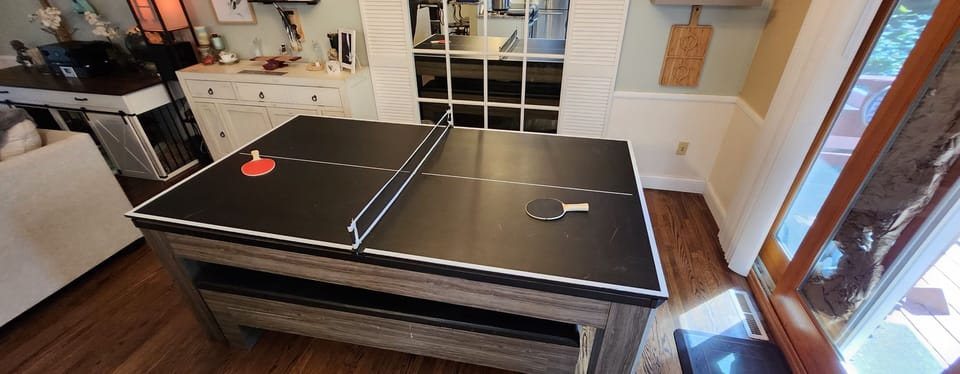 Dining room table converts to a ping pong table! All items are in the bench. 