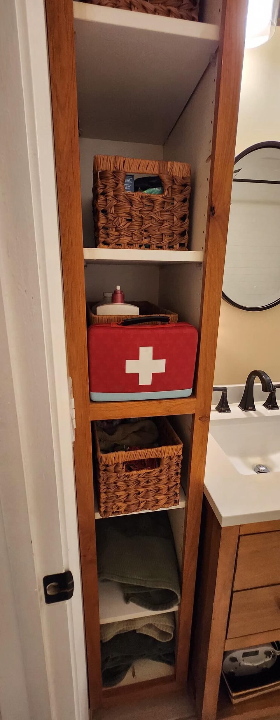 The first aid kit is located in the upstairs bathroom. 