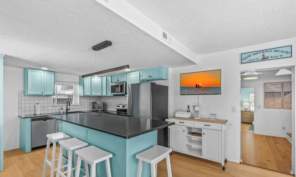 Fully equipped stainless steel Kitchen with coffee bar and island!