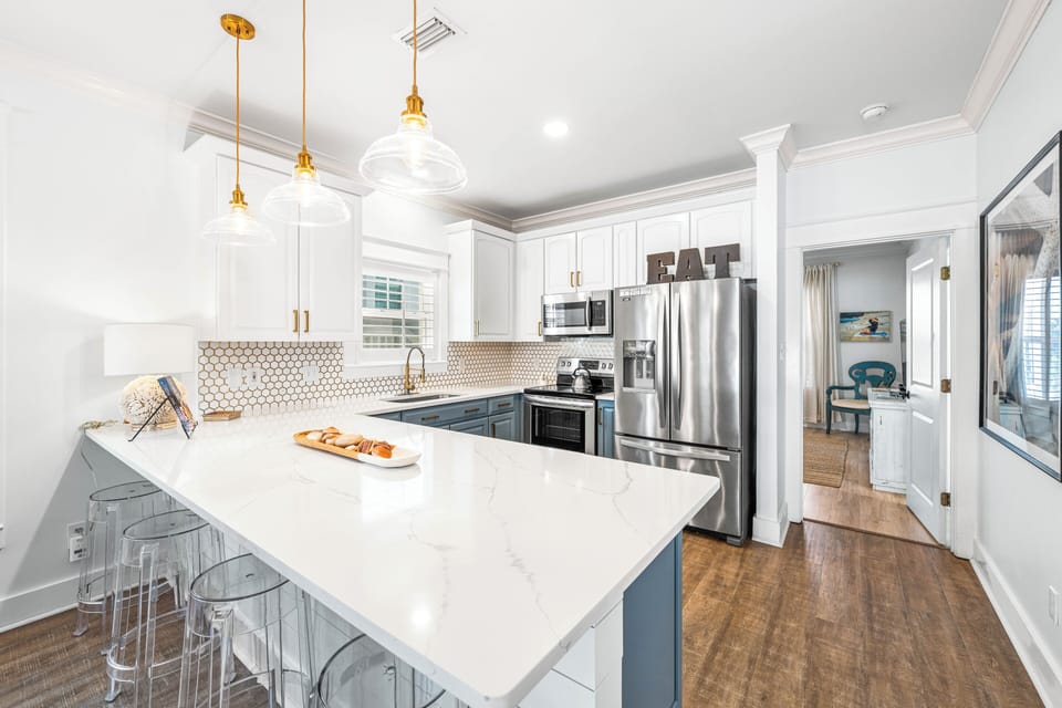 Coastal blue kitchen stocked with essentials for easy vacation meals.