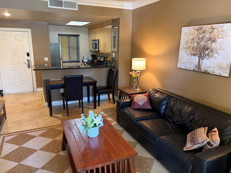 Open-concept living area featuring a comfortable living room & dining space.