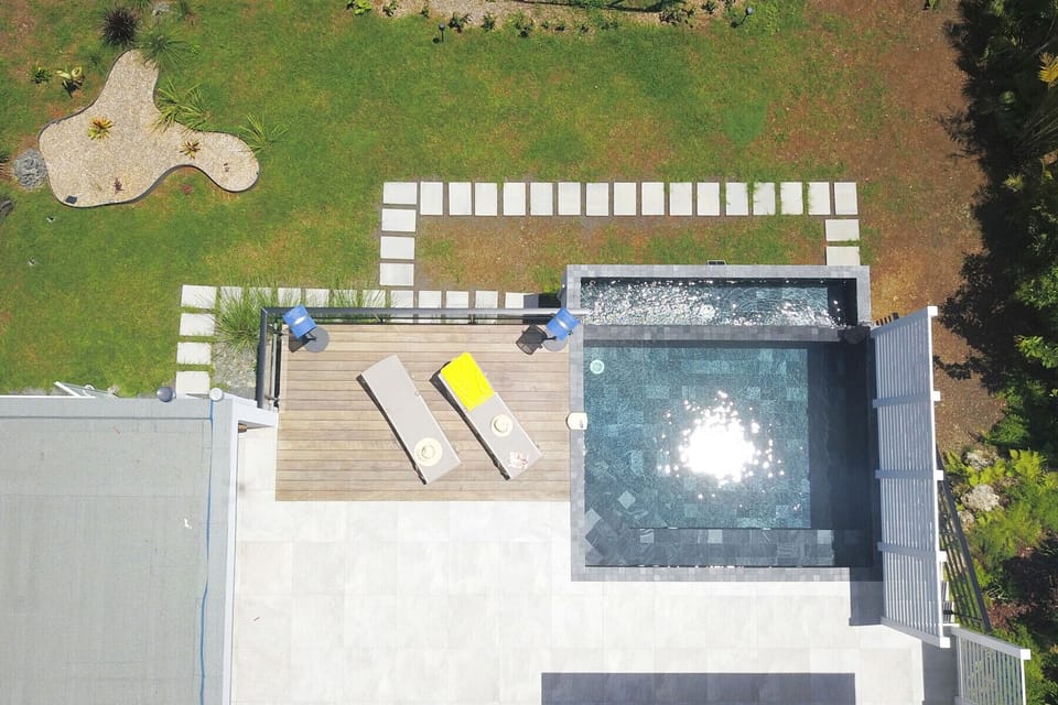 Appreciate the ideal layout of the terrace and private pool at Villa So Quiet, nestled in its greenery in Petit-Bourg.