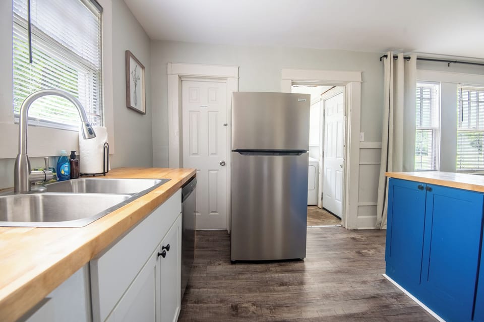 The sink, refrigerator, and generous counter space keep everything you need within easy reach while you cook, clean, and gather throughout the day.