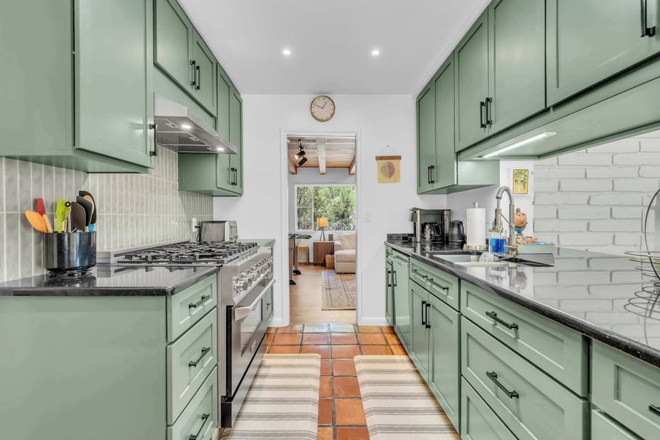 Prepare anything from quick breakfasts to family dinners in this updated kitchen, featuring modern appliances, ample counter space, and all the essentials needed for a comfortable stay.