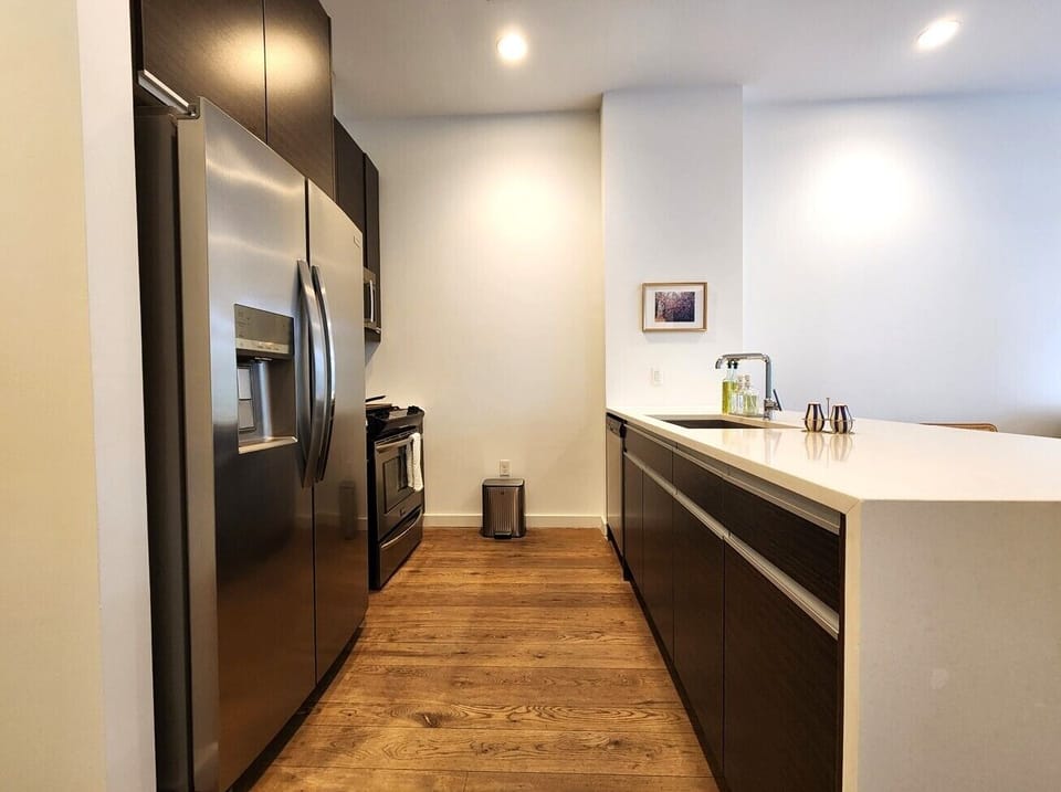 Full Kitchen with oven, dishwasher, and microwave