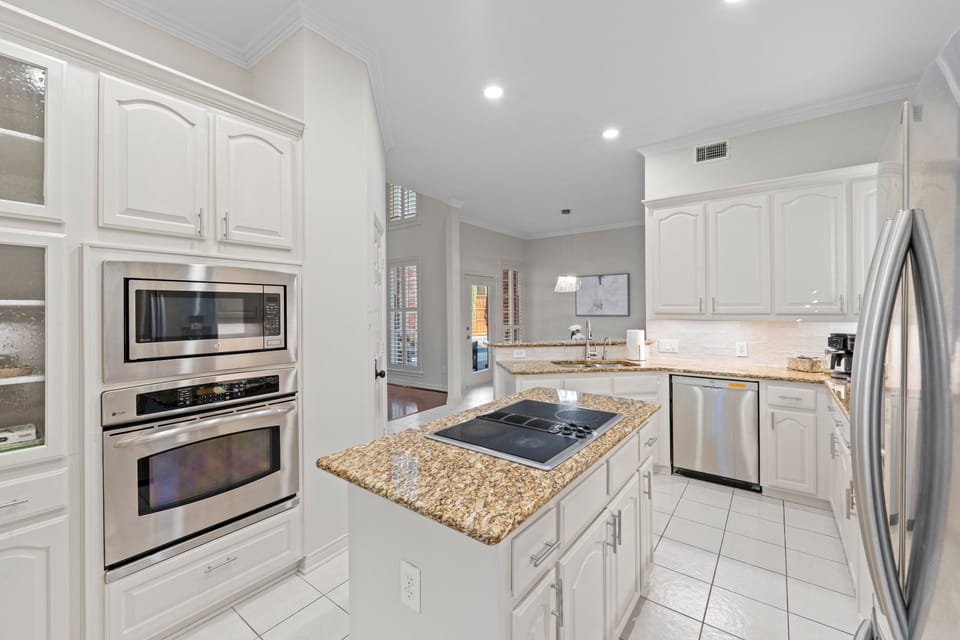 A bright, beautifully refreshed kitchen designed to feel both elevated and welcoming—perfect for starting your day slowly or gathering around while meals come together with ease.