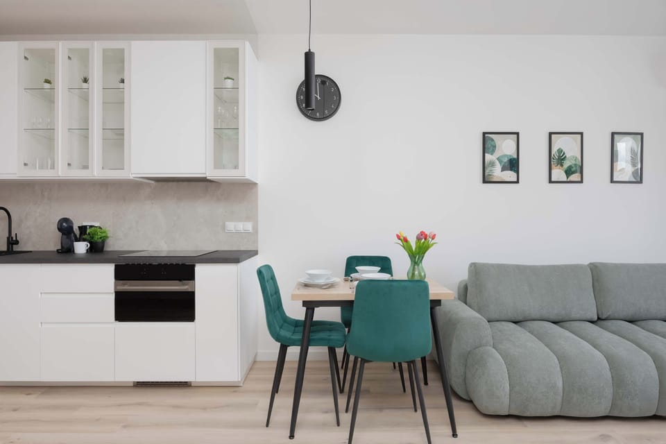 The elegant living area featuring a double sofa bed, perfect for relaxing or sleeping.