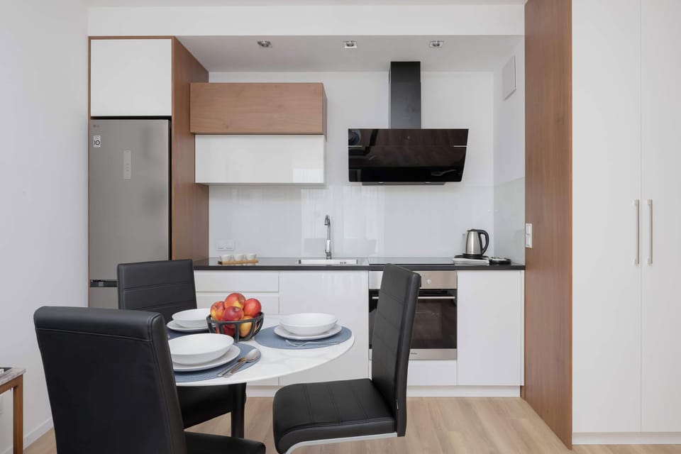 Compact kitchenette with dining space and modern appliances