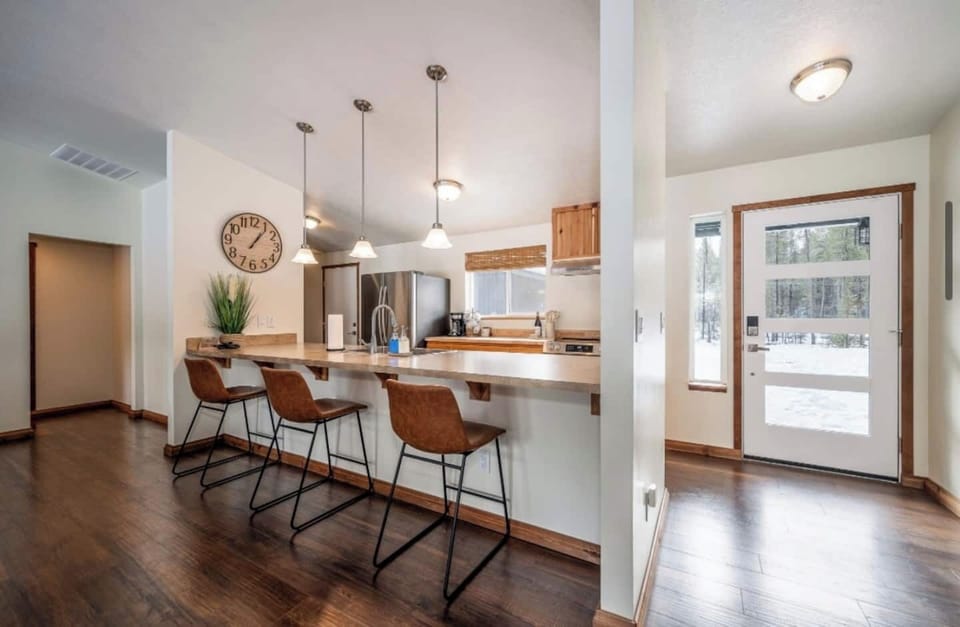 full kitchen overlooking the front and backyard of the property