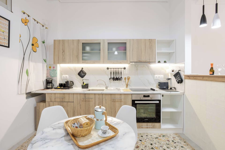 Minimalist dining area with curated décor and bright modern finishes for a comfortable stay.